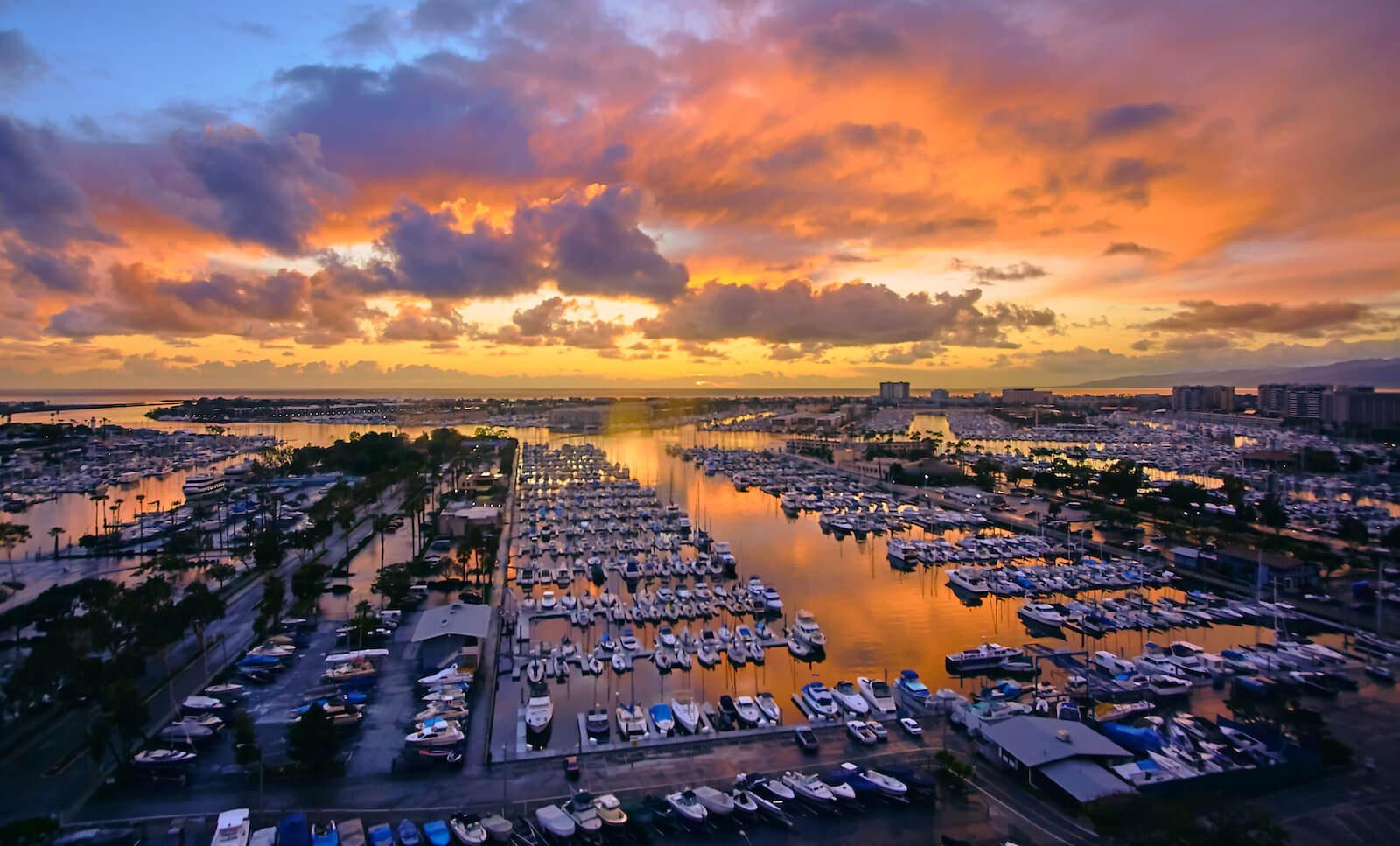 View of the Pacific Ocean in Marina Del Rey, CA, with yachts and sailboats in the water.